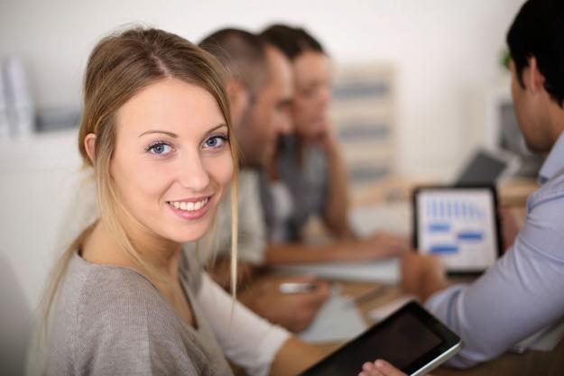 young saleswoman looking at camera